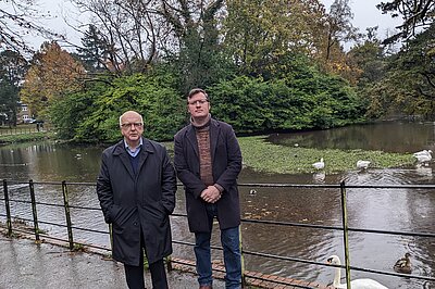Cllrs Hopkins and Waldron by the silt bank in Roath Park Lake
